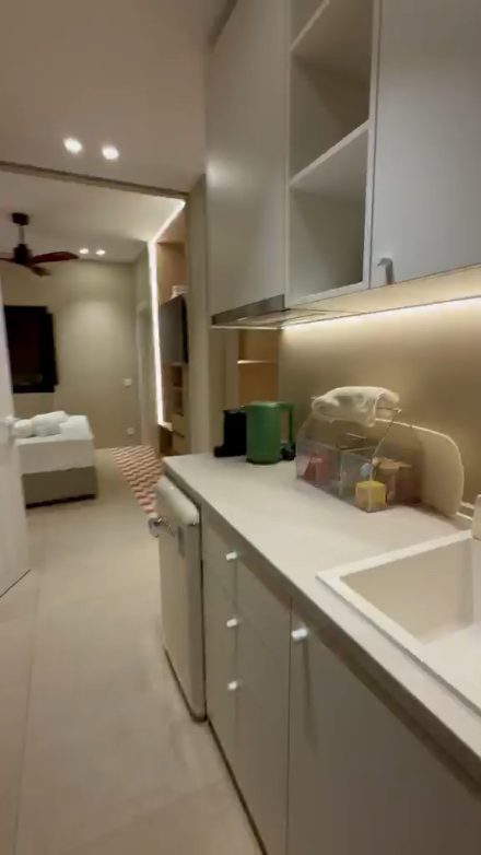 The fully equipped kitchenette looking through to the bedroom